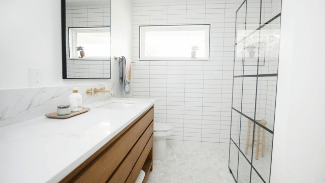 bright bathroom renovation with soft wood tones
